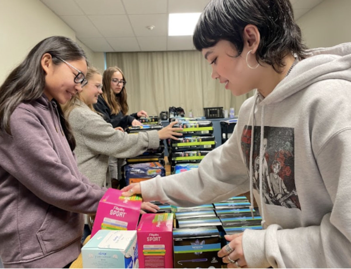(Left to right) Co-Valedictorian Francine Bondoc is pictured alongside Sailor Marenco gathering menstrual products to donate to the Collins & Katz Family YMCA in West Los Angeles and the Pasadena-Sierra Madre YMCA on Feb. 10. Bondoc remains an integral part in the Period club on campus as one of the senior  
